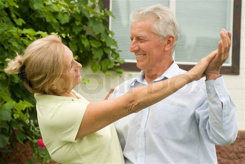 Nice elderly couple dancing, stock photo