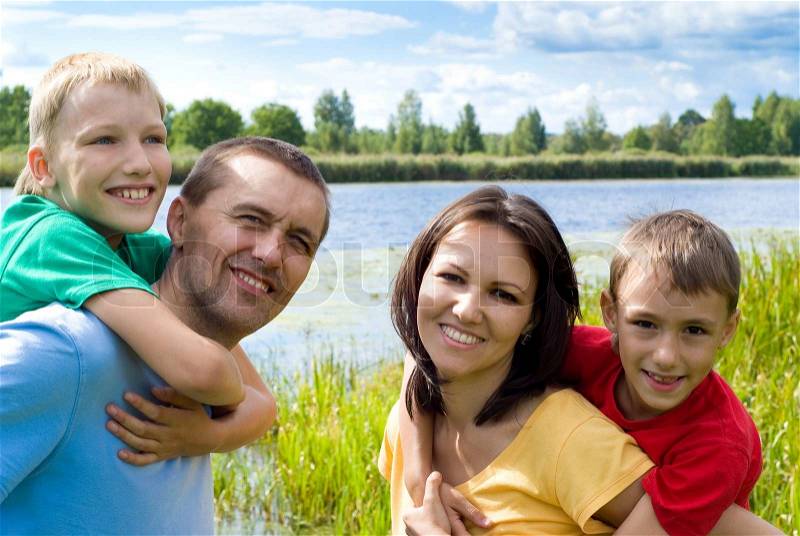Family of a four at nature, stock photo