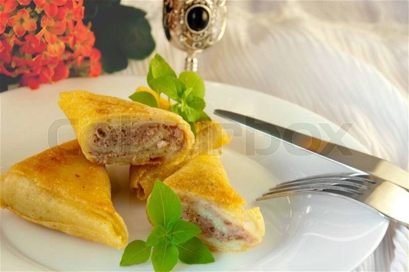 Fritters with meat and a basil, natural flowers, stock photo
