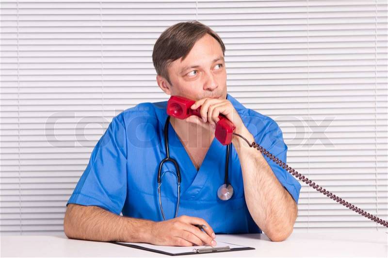 Doctor with telephone, stock photo