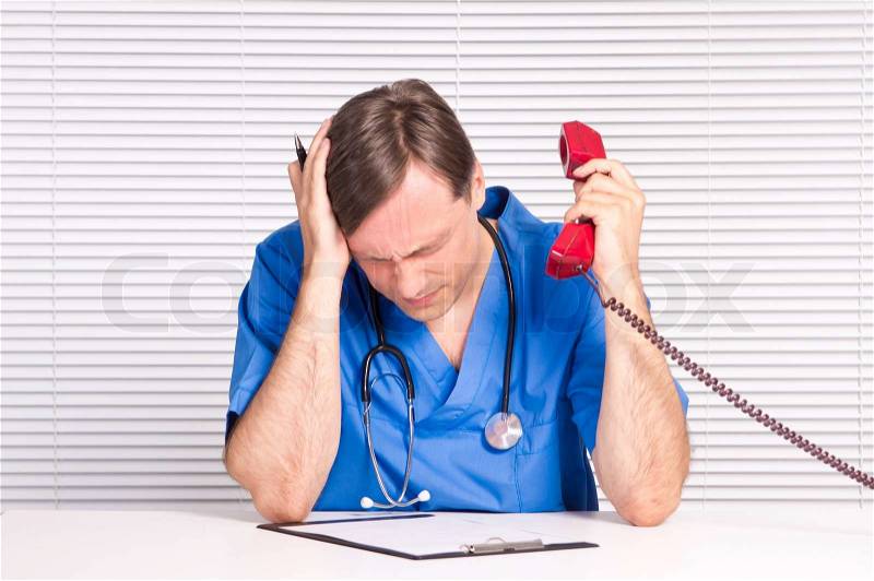 Doctor with telephone, stock photo