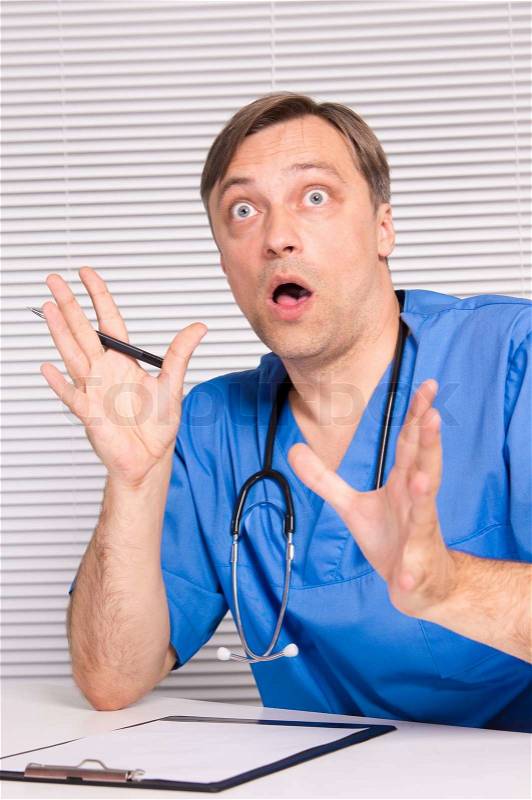 Cute doctor sitting, stock photo
