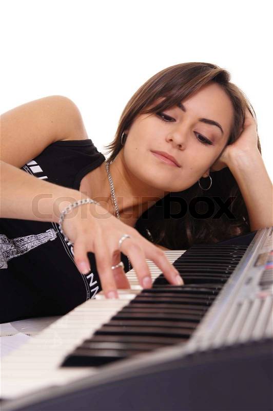 Cute girl with piano, stock photo