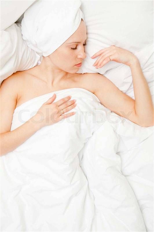 Delicate picture of beautiful woman in the bed, stock photo
