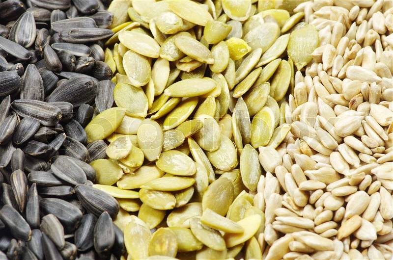 Close up image of sunflower and pumpkin seeds, stock photo