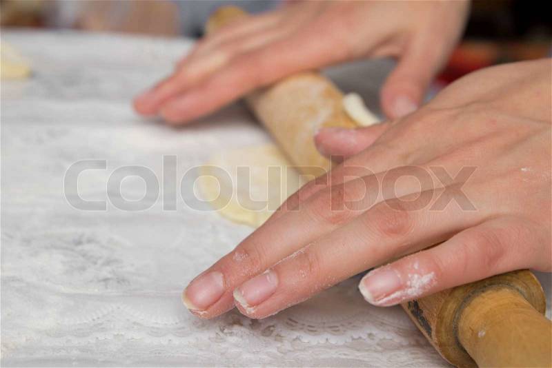 Woman hands knead dough, stock photo