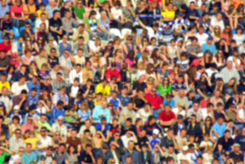 Blurred crowd of spectators on a stadium tribune at a sporting event, stock photo
