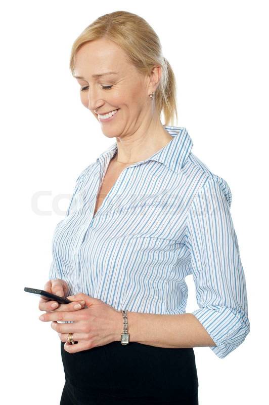 Smiling young corporate lady messaging, stock photo