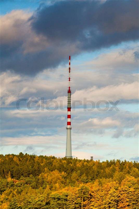 TV Transmission tower in autumn forest, stock photo