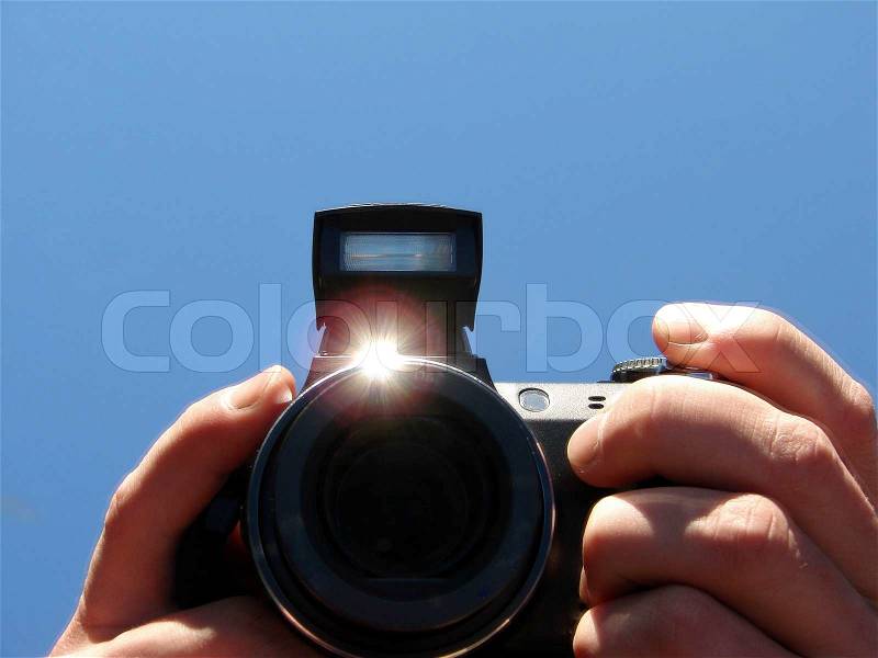 Camera in hands, stock photo
