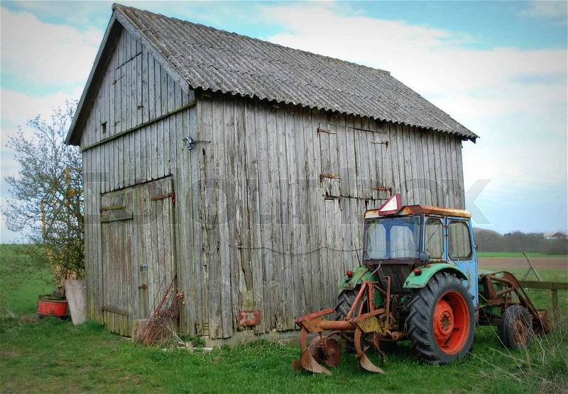 Typical Farm Scene - Old Tractor and Shed, stock photo