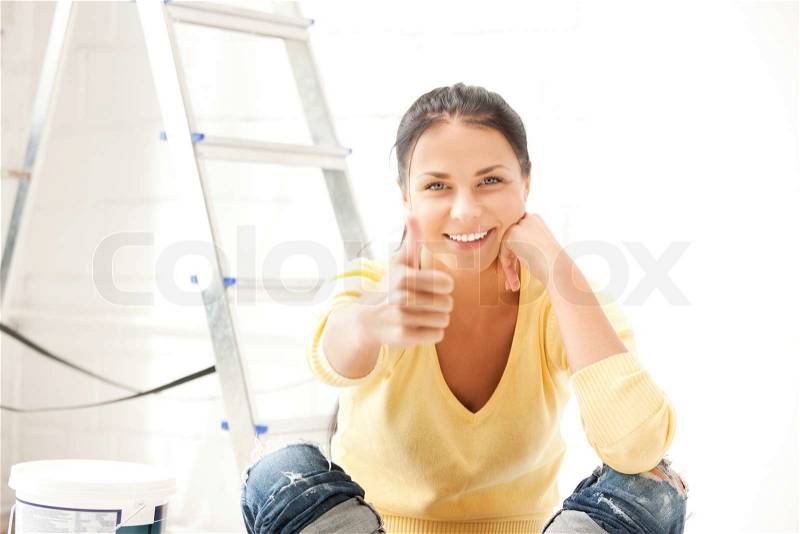 Lovely housewife making repairing works, stock photo