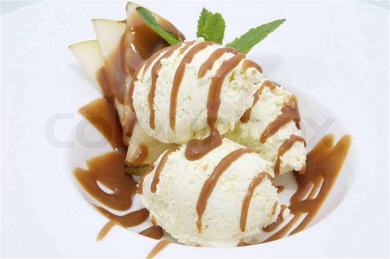 Ice cream with caramel sauce and mint on a white background, stock photo