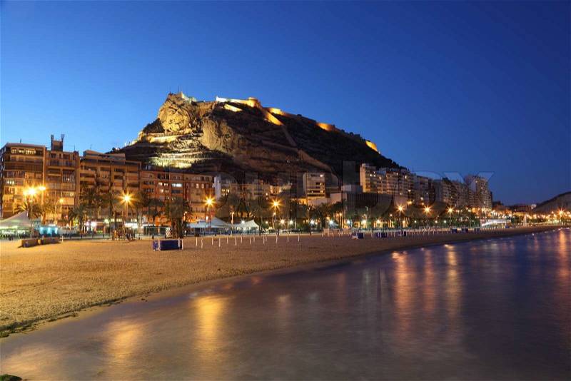 Seaside view of Alicante illuminated at night, Spain, stock photo