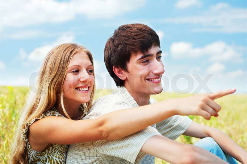 Beautiful smiley couple over blue sky, stock photo