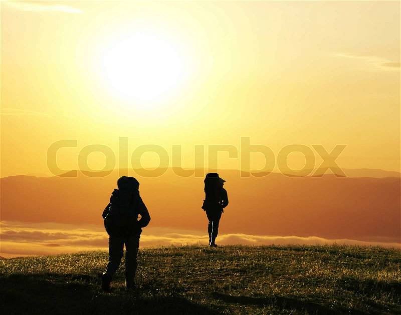 Hike on sunset, stock photo