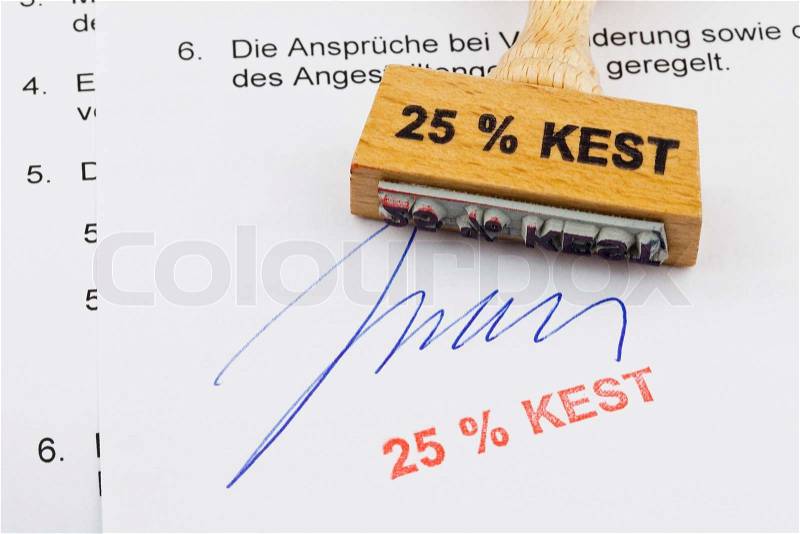Wood stamp on the document: 25% kest, stock photo