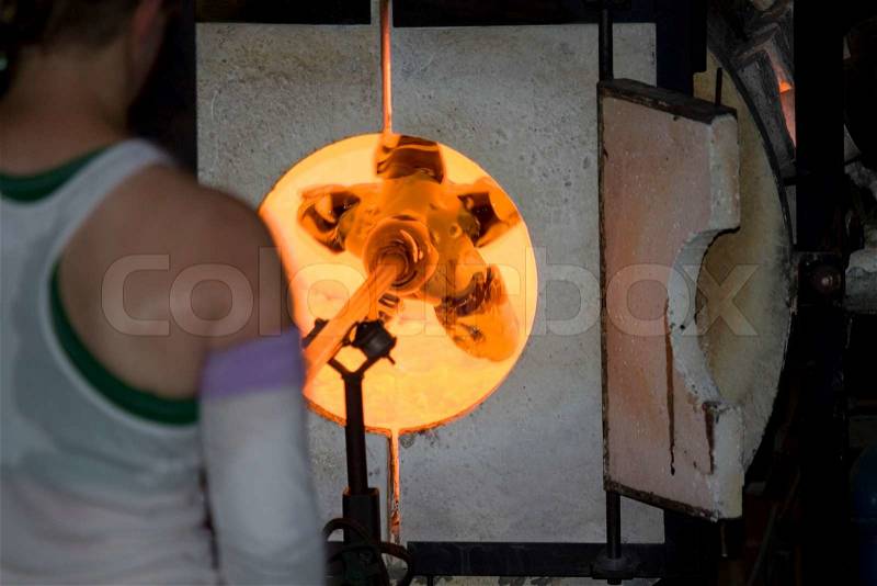 Glass furnace Glass Blower at Work, stock photo