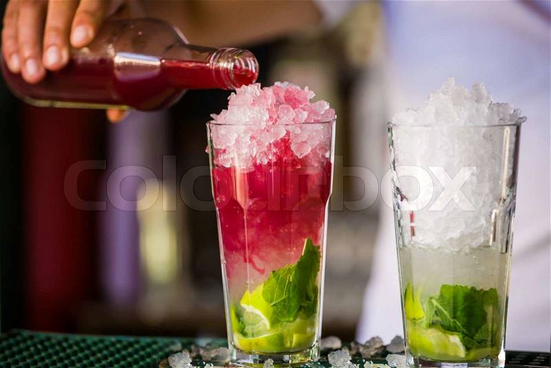 Barmen mixes a cocktail, stock photo