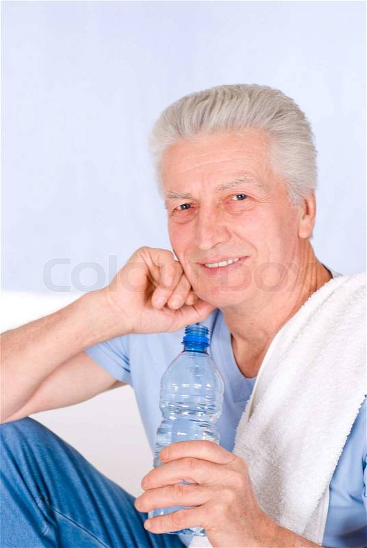 Old guy drinking, stock photo