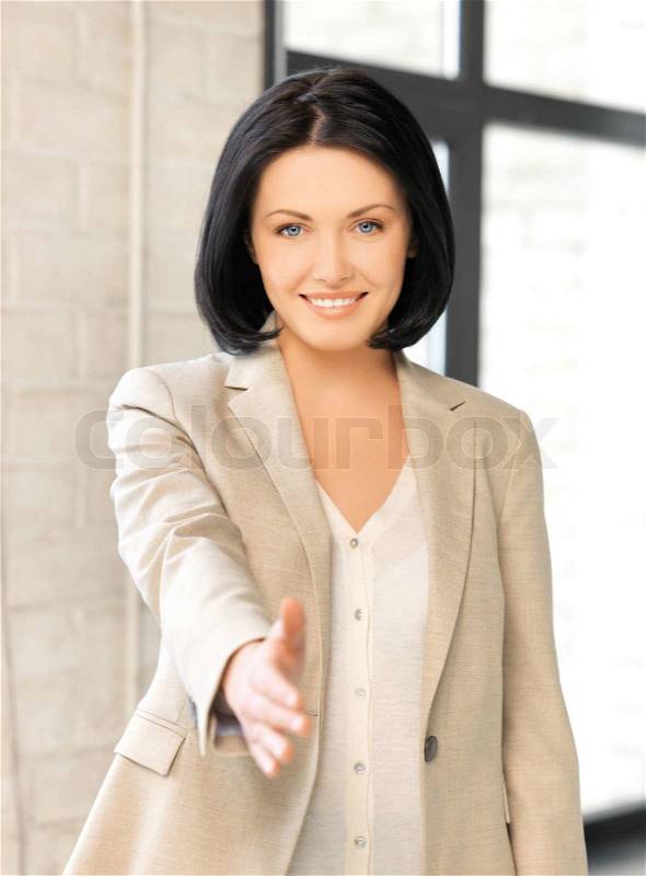 Woman with an open hand ready for handshake, stock photo