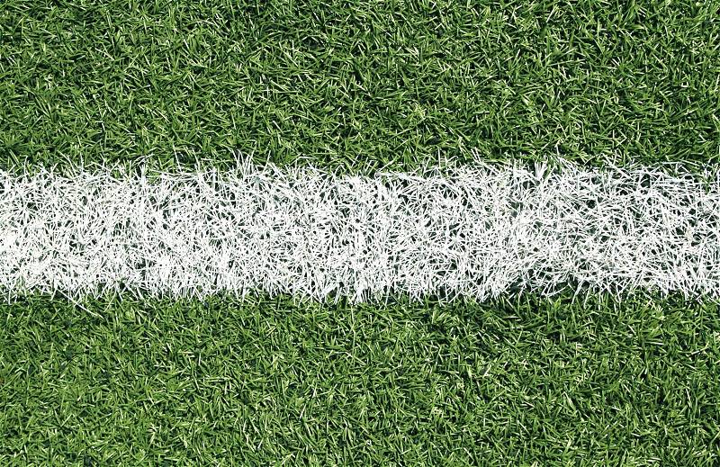 Intersection of white line on soccer football field, stock photo