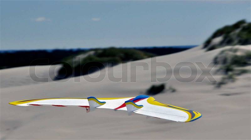 Model airplanes freely hovering over Raabjerg Mile, stock photo