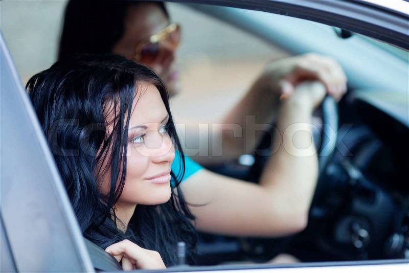 Woman and man in the car, stock photo