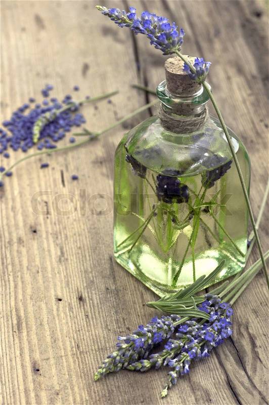 Essential herbal lavender oil with fresh flowers, stock photo