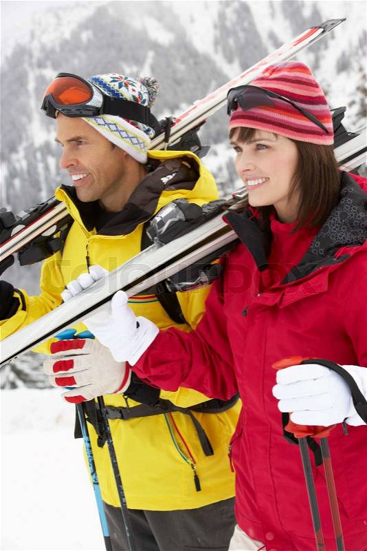 Middle Aged Couple On Ski Holiday In Mountains, stock photo