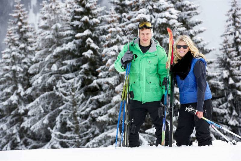Young Couple On Ski Holiday In Mountains, stock photo