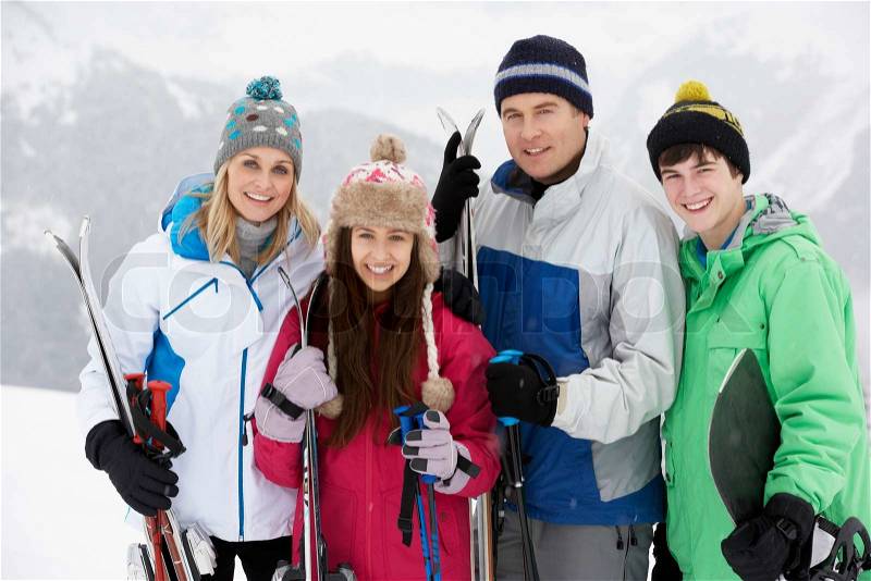 Family On Ski Holiday In Mountains, stock photo