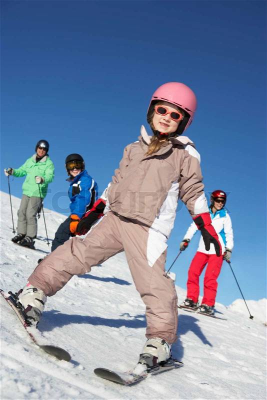 Family On Ski Holiday In Mountains, stock photo
