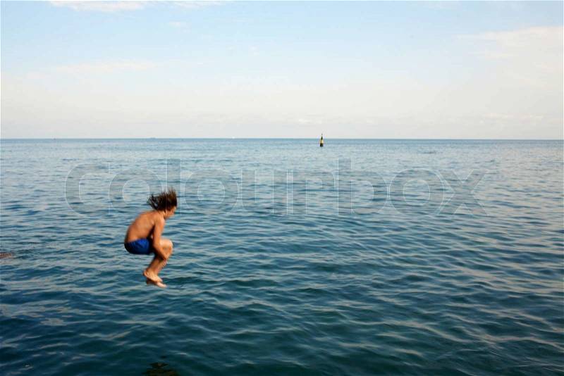 Jumping in water, stock photo