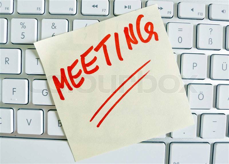 Note on computer keyboard: meeting, stock photo