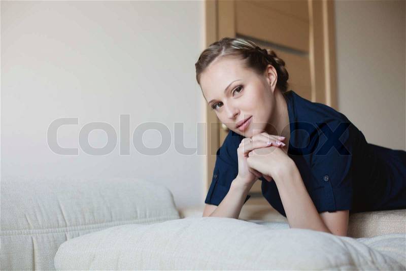 Woman on the bed, stock photo