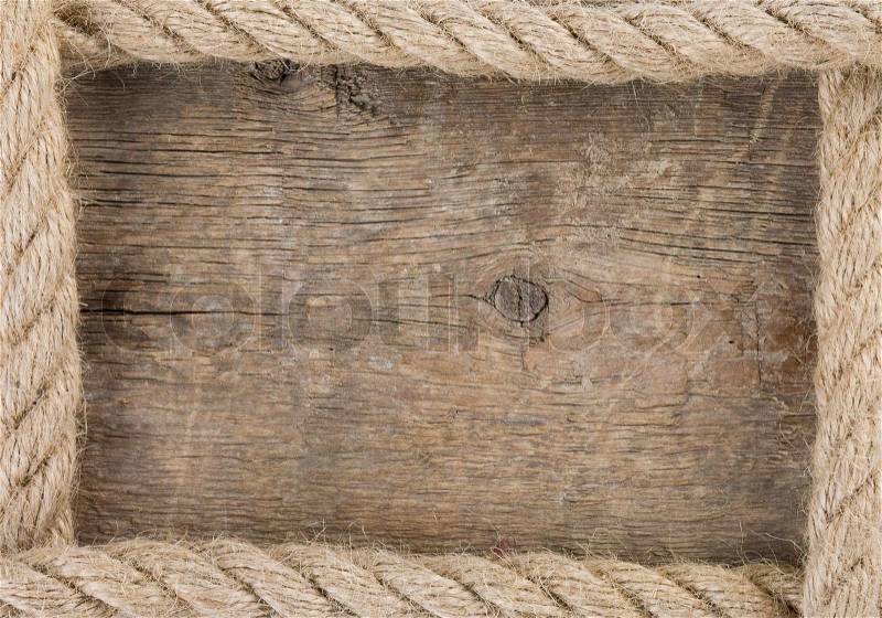 Ship rope and old wood background, stock photo