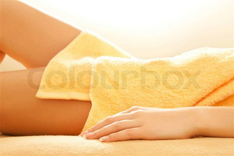 Female hands and legs in spa salon, stock photo