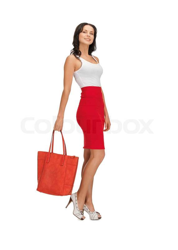 Woman in dress with a bag | Stock Photo | Colourbox