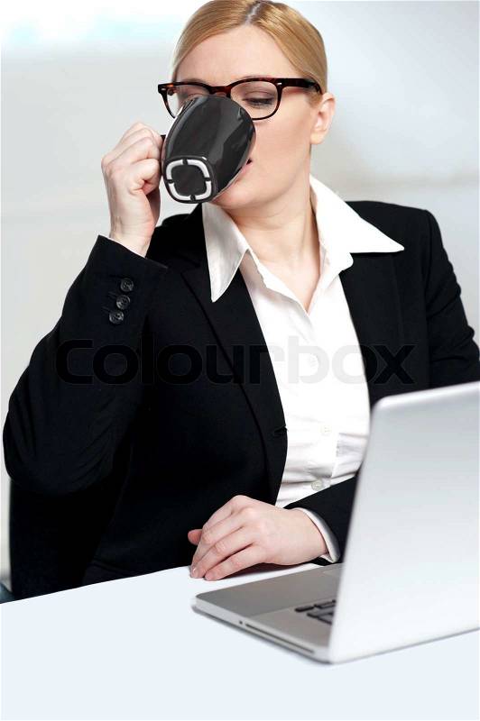 Corporate lady drinking coffee, stock photo