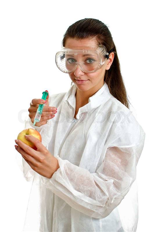 Female scientist in lab coat with syringe and apple Isolated on