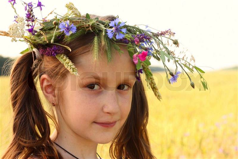 Girl with flowers diadem on her head, stock photo