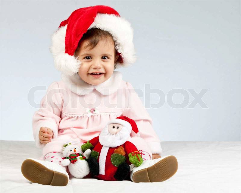 Little pretty girl with santa\'s hat, stock photo