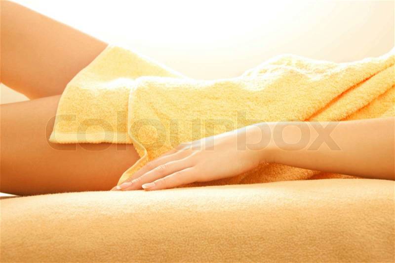 Female hands and legs in spa salon, stock photo