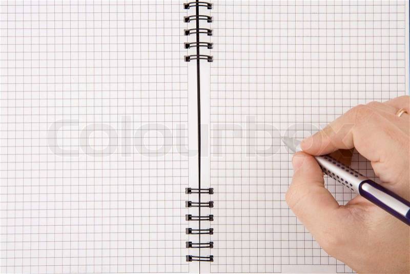 Hand writing by pen on notebook, stock photo