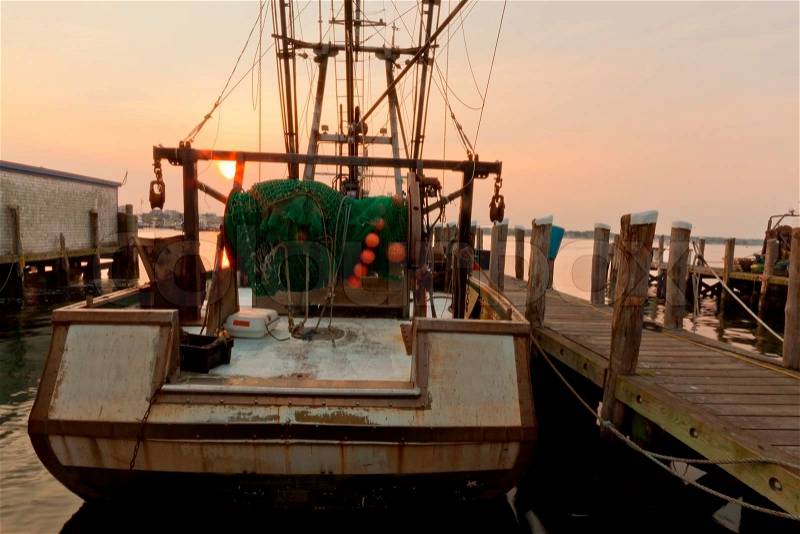 Docked fishing boat at sunset in Naragansett Bay, Rhode Island, stock photo