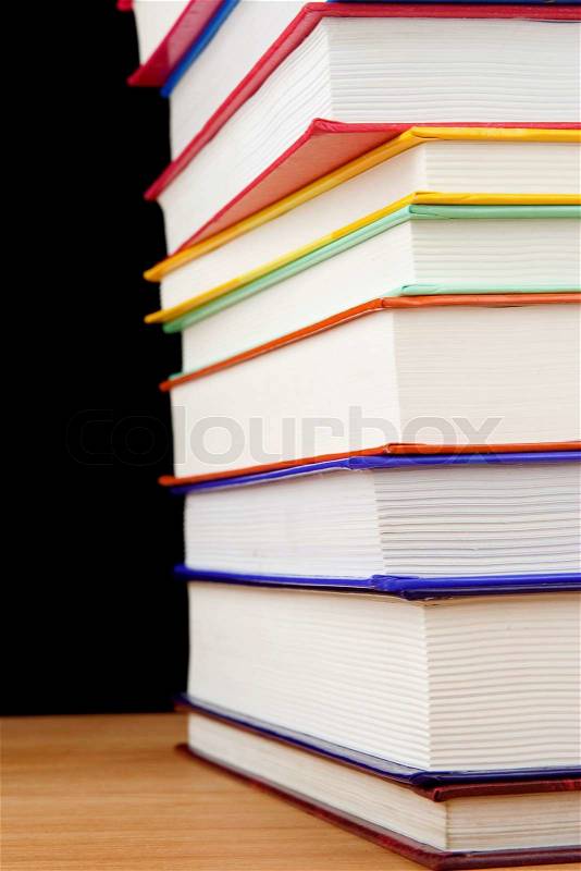 Pile of books isolated on black, stock photo