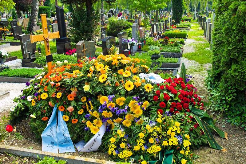 A fresh grave in a cemetery, stock photo