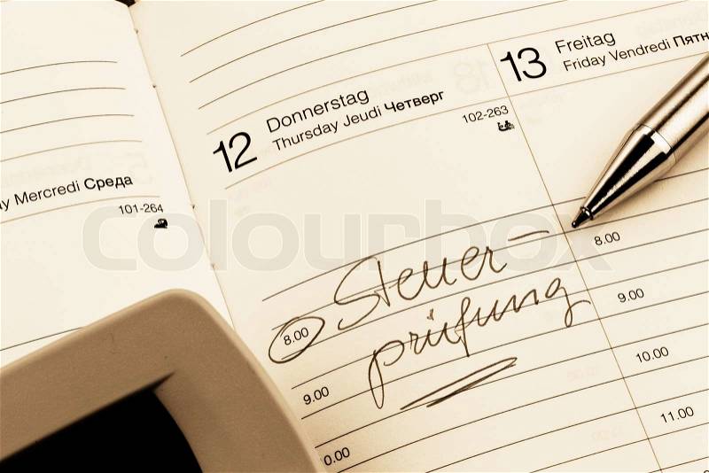Entry in calendar: tax audit, stock photo