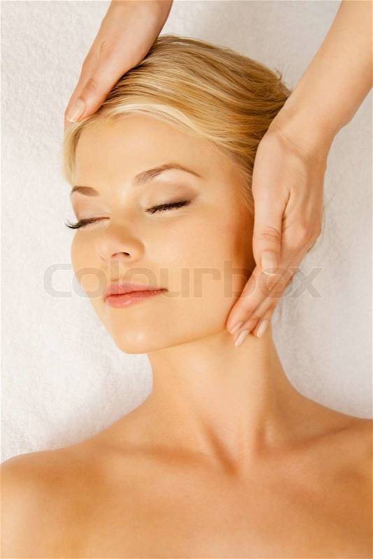 Picture of happy beautiful woman in massage salon, stock photo